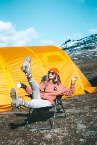 Women sitting in a camping chair